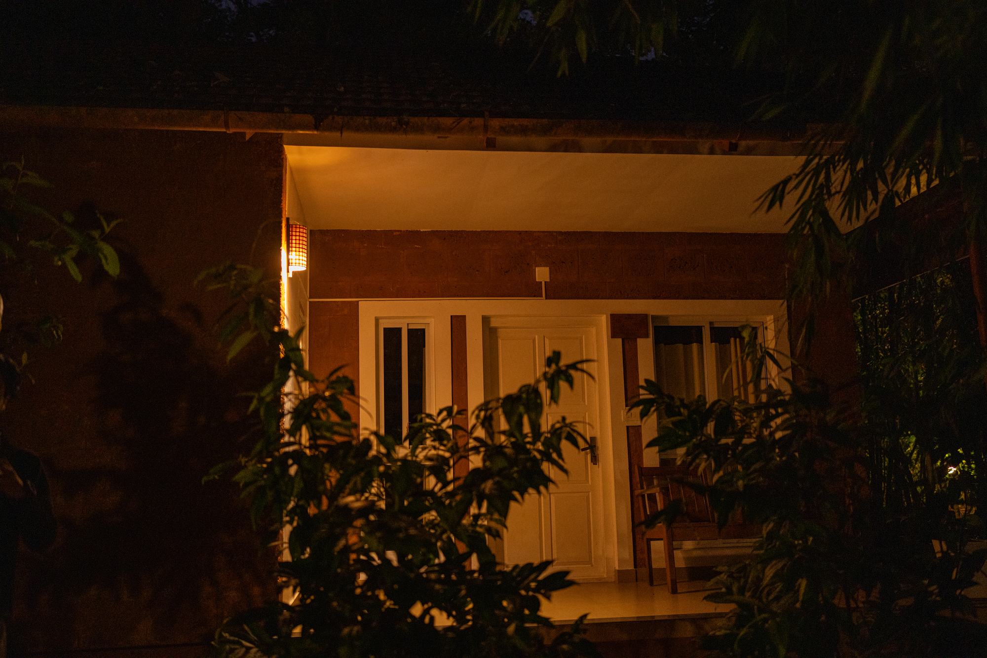 Traditional cottage lit up at night