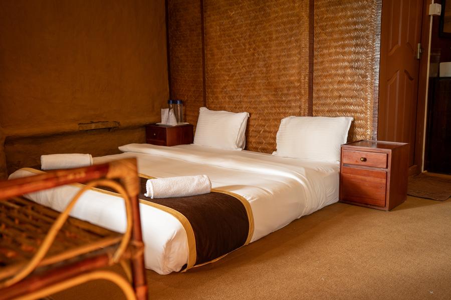 Twin beds inside the canopy hut