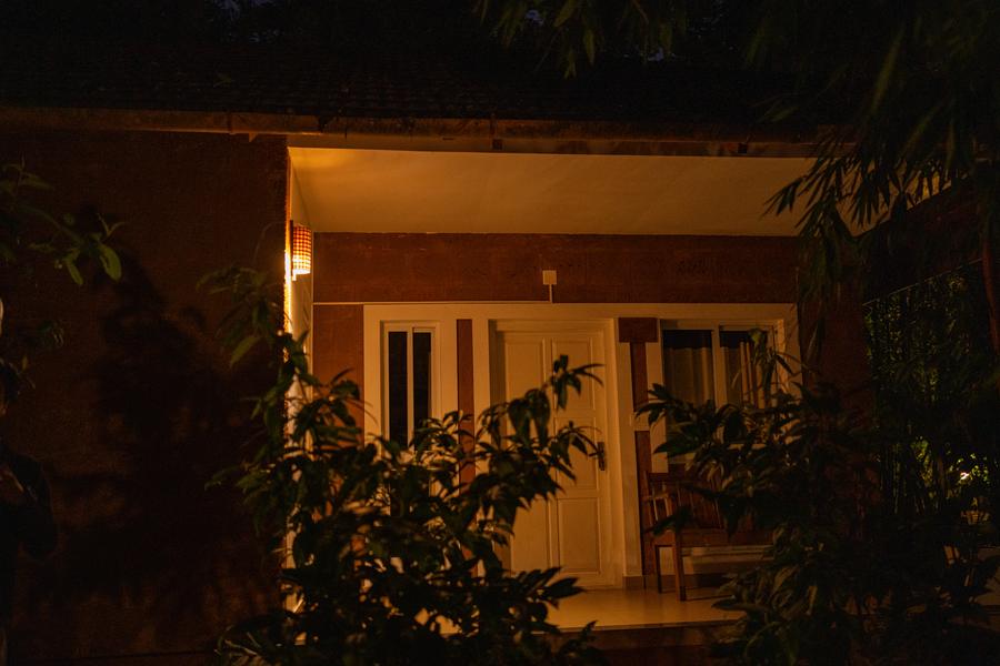 Traditional cottage lit up at night