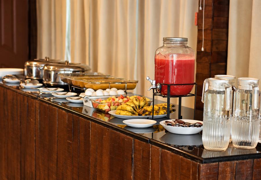 Breakfast spread with juice and fresh fruit
