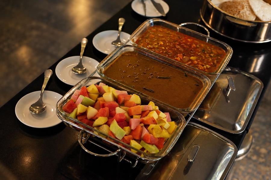 Buffet of Kerala dishes and fruit