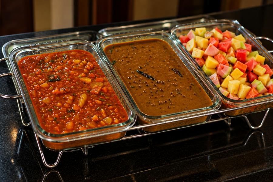 Curries and fruit at the buffet